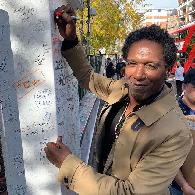 Canterbury Poet Laureate @lemnsissay follows tradition and signs the famous wall at @abbeyroadstudios.
